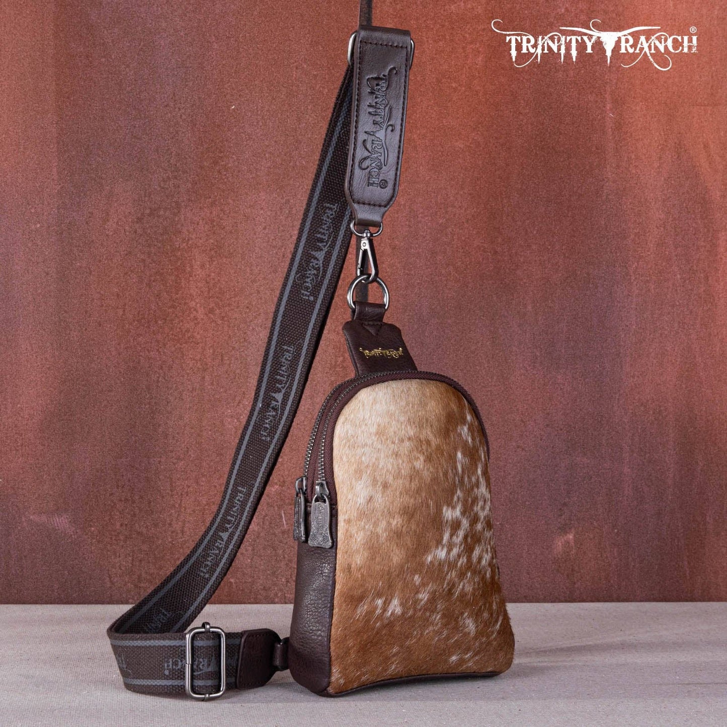 TR159-210 Trinity Ranch Genuine Hair-On Cowhide Collection Sling Bag