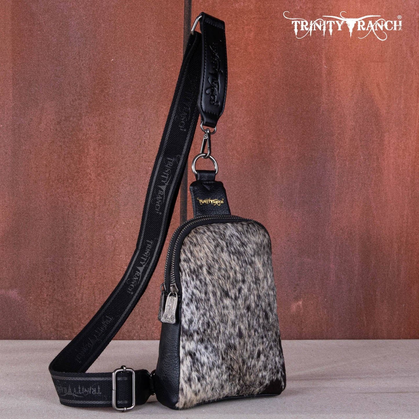 TR159-210 Trinity Ranch Genuine Hair-On Cowhide Collection Sling Bag