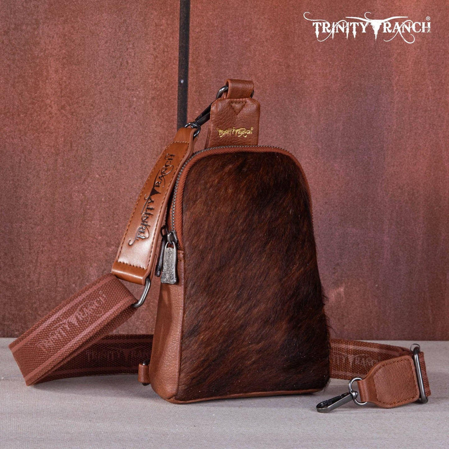 TR159-210 Trinity Ranch Genuine Hair-On Cowhide Collection Sling Bag