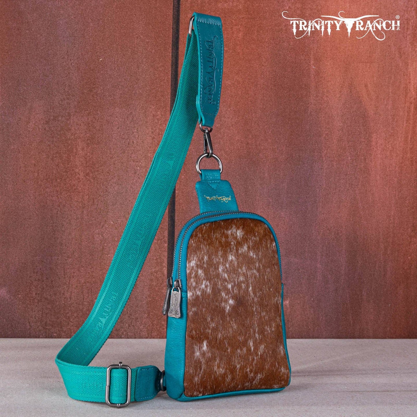 TR159-210 Trinity Ranch Genuine Hair-On Cowhide Collection Sling Bag