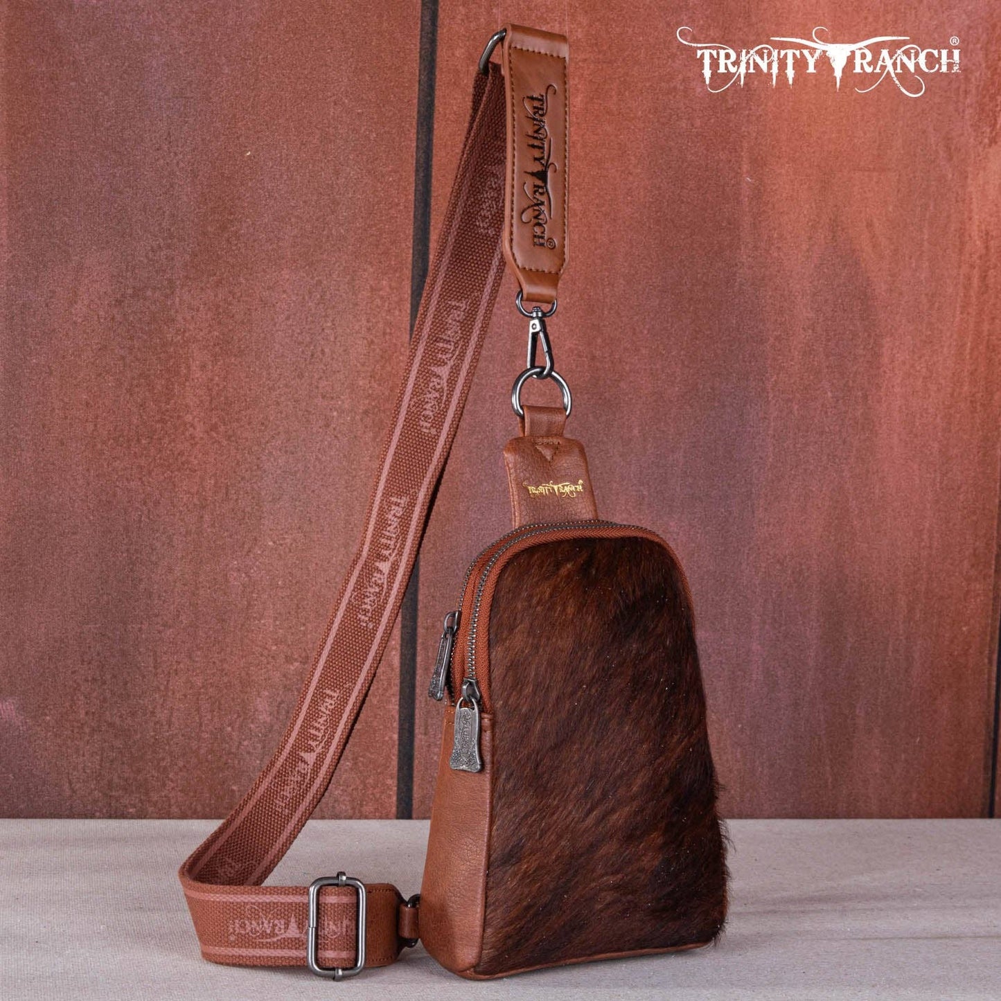TR159-210 Trinity Ranch Genuine Hair-On Cowhide Collection Sling Bag