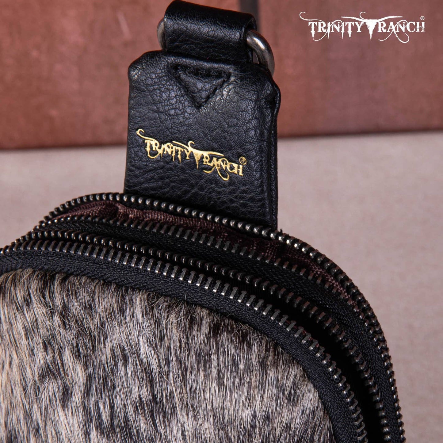 TR159-210 Trinity Ranch Genuine Hair-On Cowhide Collection Sling Bag